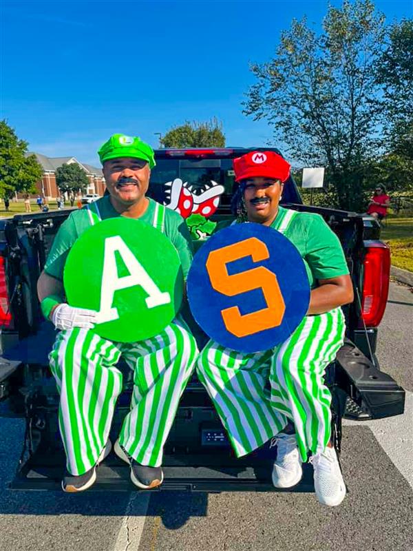 principal and vice principal dressed as mario and luigi